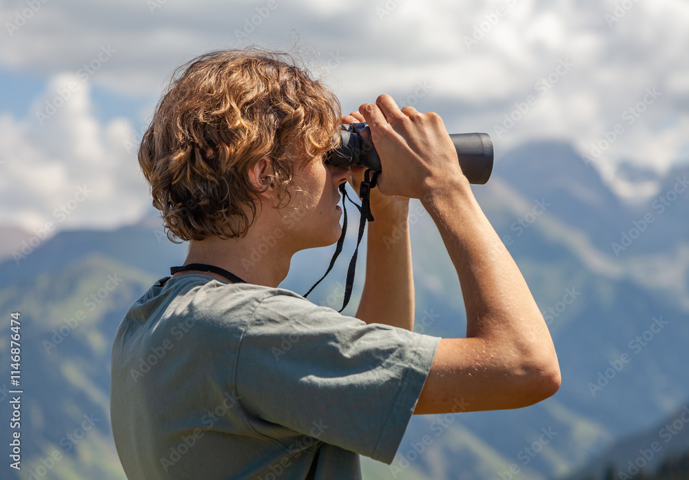 Hiker looking through binoculars on the mountain.
Young man using binoculars. Man looking through binoculars. Hiker looking through binoculars on the mountain.
Young man using binoculars. Man looking through binoculars.