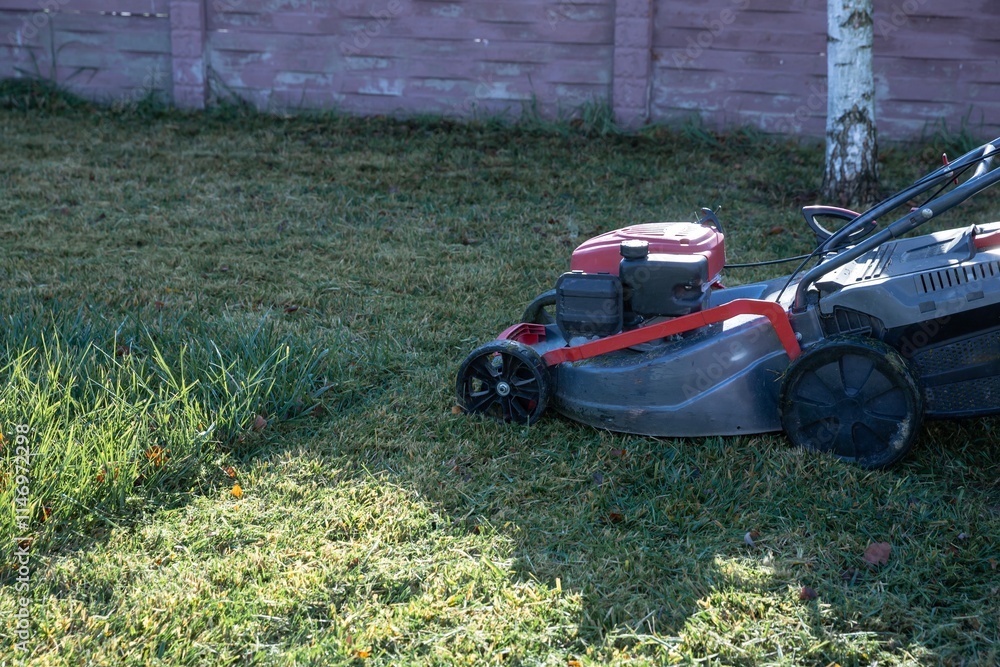 Close-Up of a Lawn Mower Cutting Grass on a Sunny Day Close-Up of a Lawn Mower Cutting Grass on a Sunny Day
