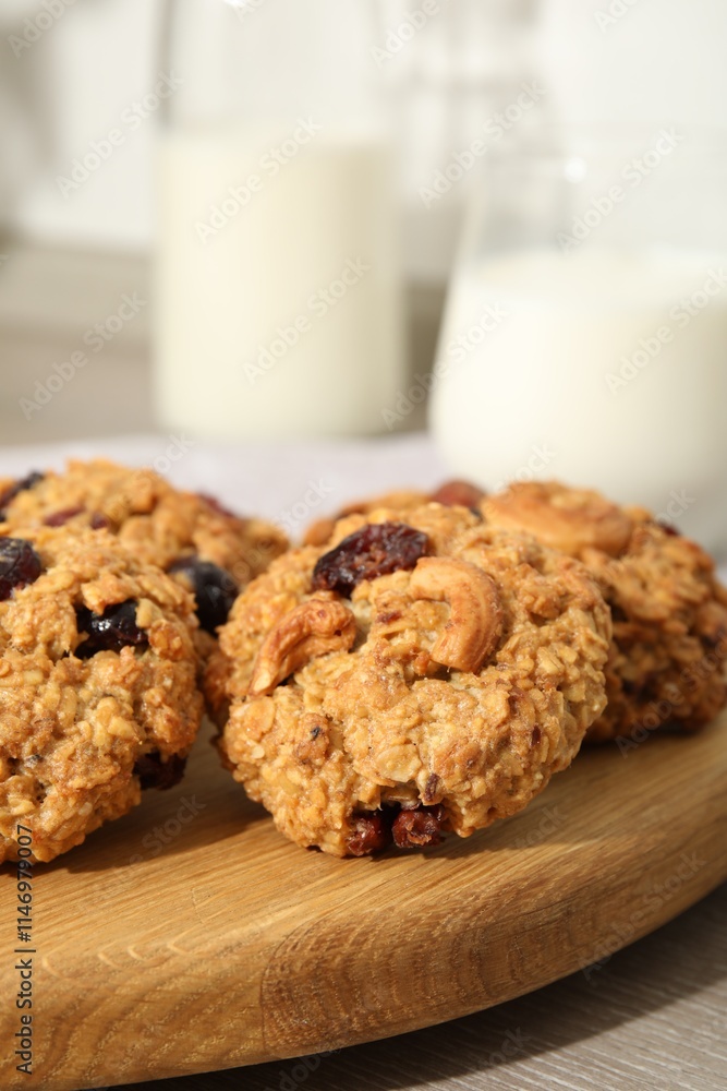 Delicious oatmeal cookies with raisins and nuts on table, closeup Delicious oatmeal cookies with raisins and nuts on table, closeup