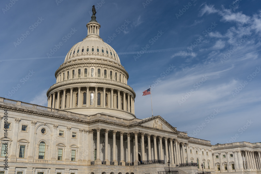 Fototapeta premium Washington DC - October 27, 2024: United States Capitol Building with Blue Sky Background