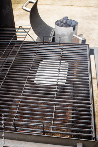 Barbeque smoker with fire starter with coals