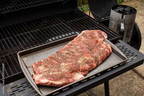 Pork spare ribs cooked and smoked on the barbeque