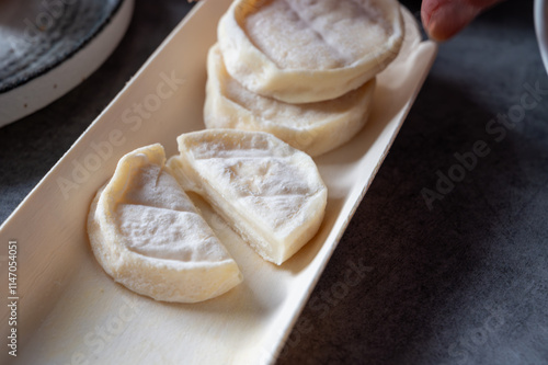 Rocamadour or cabecous soft goat AOC cheese with soft rind produced on farm in Perigord and Quercy on farmers market, departement Lot, France photo