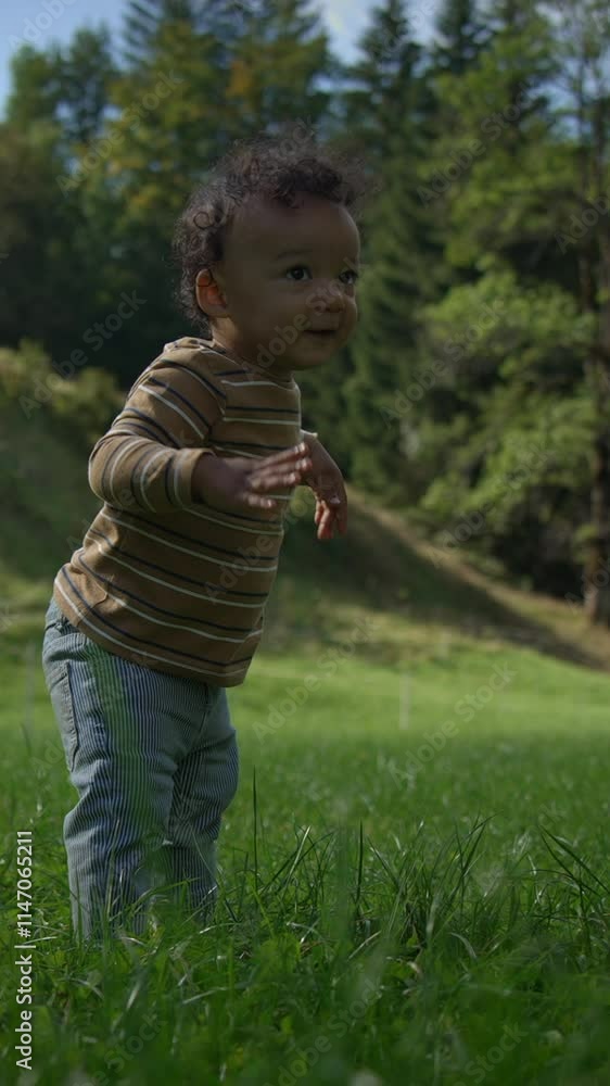 A Joyful Toddler Happily Playing in Natures Beautiful Embrace and Exploring the Outdoors A Joyful Toddler Happily Playing in Natures Beautiful Embrace and Exploring the Outdoors