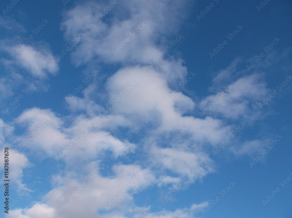 Beautiful white puffy clouds in a deep blue sky. Beautiful white puffy clouds in a deep blue sky.