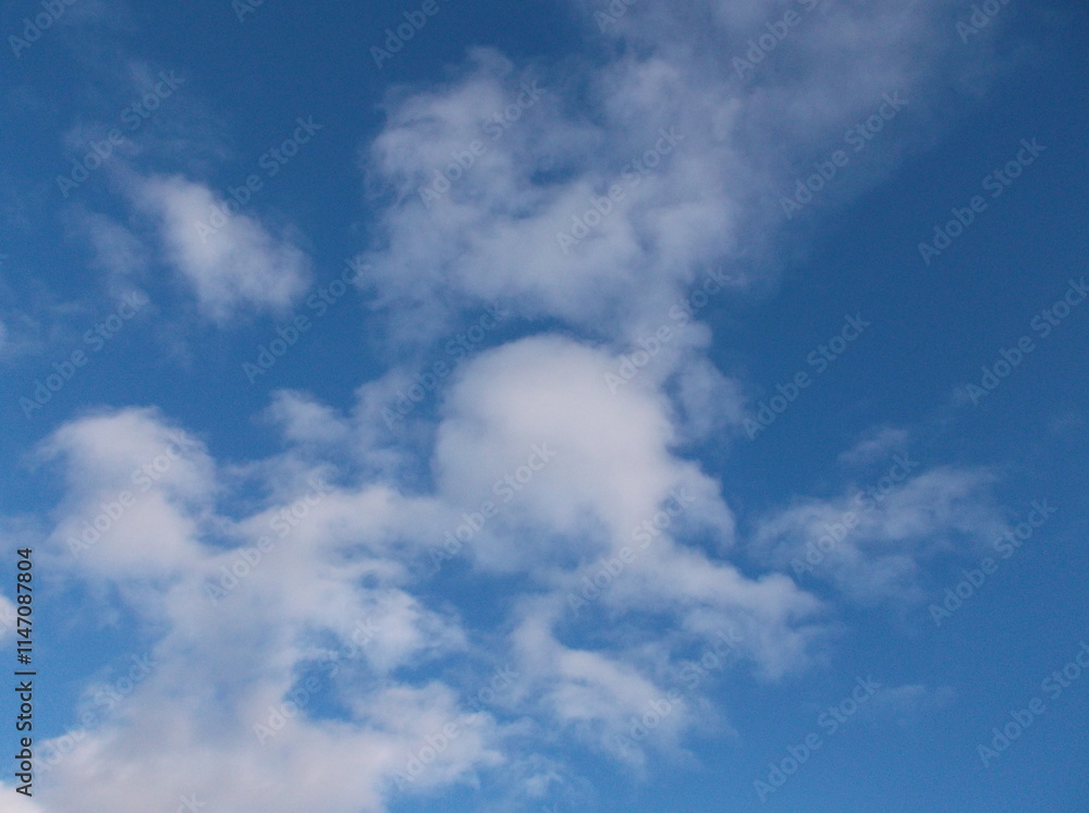 Beautiful white puffy clouds in a deep blue sky. Beautiful white puffy clouds in a deep blue sky.