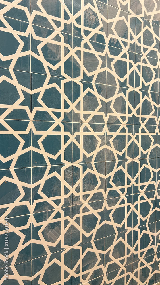 Decorative wall tiles with a geometric Islamic pattern in white and teal, creating an intricate symmetrical design. Ideal for interior decor, mosques, cultural centers, and design projects. Decorative wall tiles with a geometric Islamic pattern in white and teal, creating an intricate symmetrical design. Ideal for interior decor, mosques, cultural centers, and design projects.