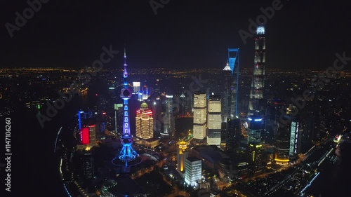 Wallpaper Mural SHANGHAI, CHINA - NOVEMBER 7, 2024: Stunning aerial view of illuminated skyscrapers showcasing the vibrant skyline at night Torontodigital.ca
