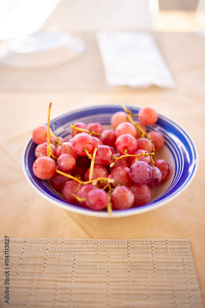 Red tasty fruity grapes served in a bowl Red tasty fruity grapes served in a bowl