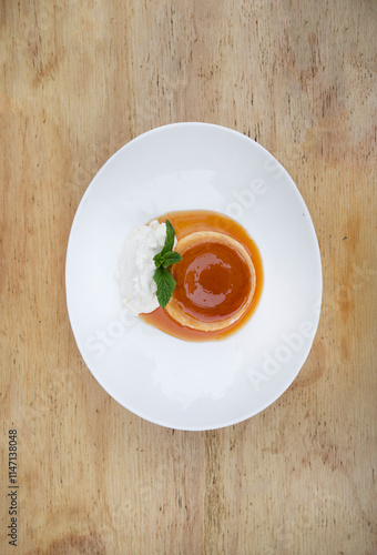 Traditional gourmet dessert. Top view of a flan with cream and caramel