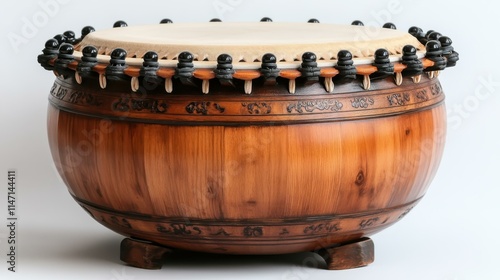 Traditional Cultural Instruments Korean janggu drum with a double-headed design and a wooden body Isolated solo on plain background photo