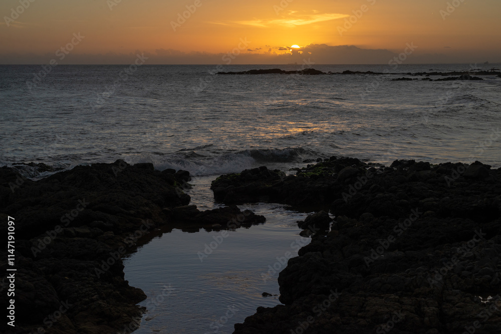 Fototapeta premium Beautiful and romantic orange sunset over the sea. Preserved environment.