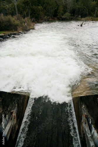 Water Flowing Out of Flood Gate Close-Up, Powerful Stream in Motion
 photo