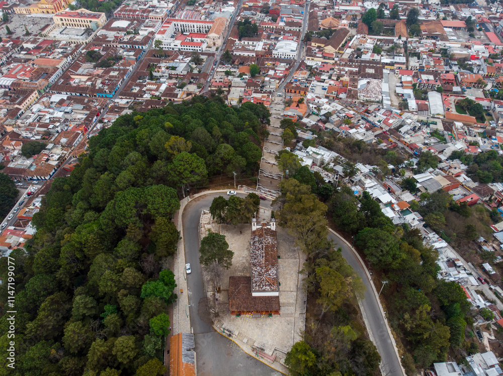 Aerial Drone shot of Church Iglesia de San Cristobalito on the mountain in San Cristobal de Las Casas, Chiapas, Mexico