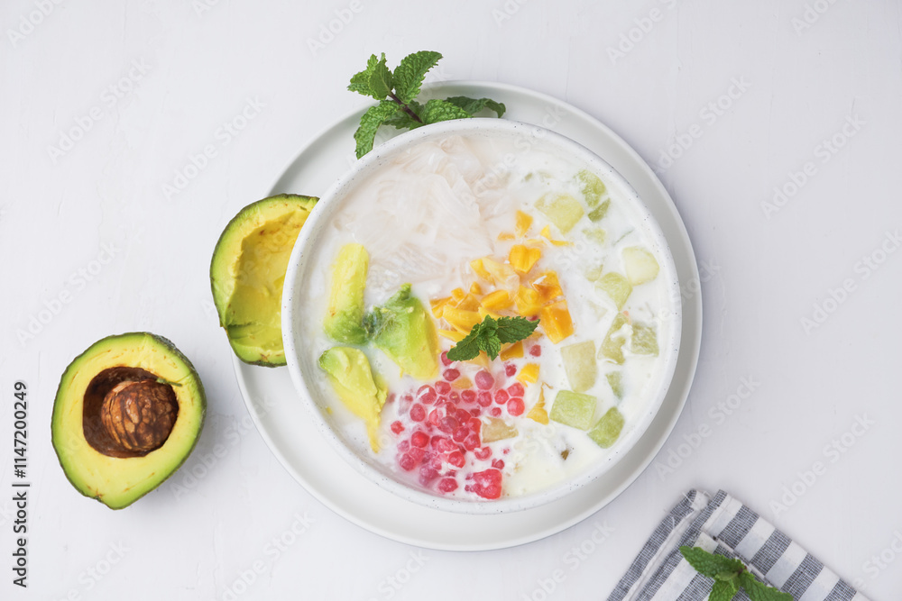 Mixed Ice, made from gelatin, tapioca pearls, ice, young coconut, sugar syrup, mixed fruit and coconut milk or milk. hemp during the month of Ramadan. Indonesian street food. Mixed Ice, made from gelatin, tapioca pearls, ice, young coconut, sugar syrup, mixed fruit and coconut milk or milk. hemp during the month of Ramadan. Indonesian street food.