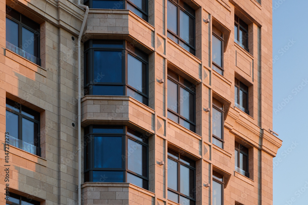 Naklejka premium Innovative and Modern Architectural Design Featuring Elegant Windows and a Textured Facade