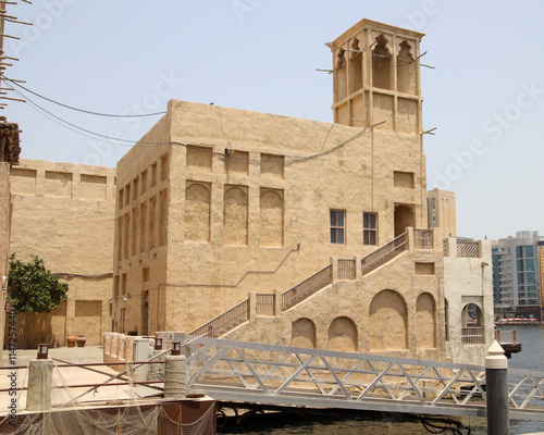 Traditional arab multi storey house in the old town Dubai creek dock photo