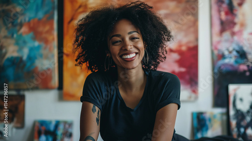 Joyful female artist sitting vibrant studio colorful artwork creativity passion artistic expression space content artistic lifestyle smile happy confident dark skin white blonde black hair painter