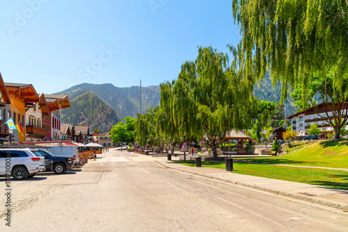 The main treelined street through the picturesque Bavarian themed town of Leavenworth, Washington, in the Cascade Mountains of Eastern Washington State.	 photo