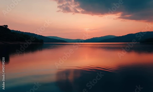 Wallpaper Mural Serene sunset reflecting on a tranquil lake surrounded by mountains. Torontodigital.ca