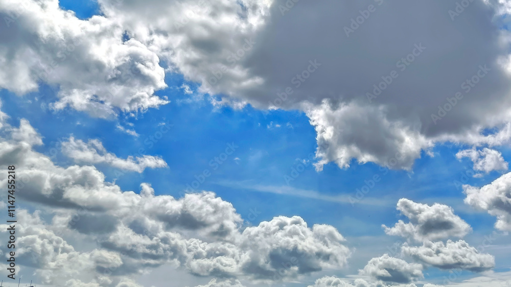 Bright blue sky and thick white clouds. Beautiful white clouds in bright blue sky as nature concept. Bright blue sky and thick white clouds. Beautiful white clouds in bright blue sky as nature concept.