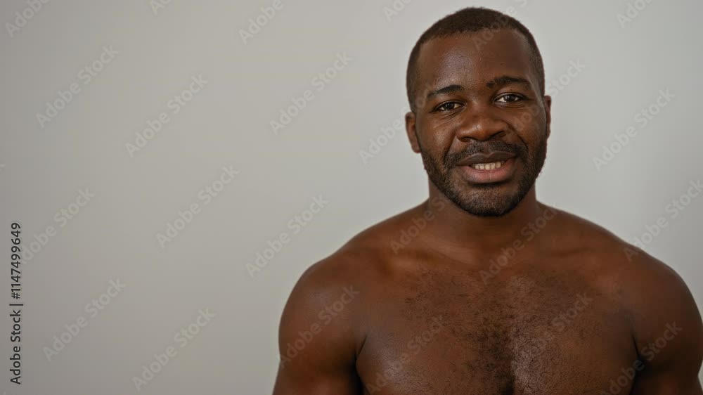Young man standing shirtless over isolated white background Young man standing shirtless over isolated white background
