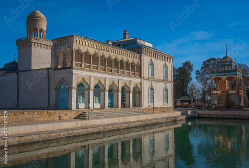 View of the harem building and the summer mosque on the territory of the Sitorai Mokhi Khosa Palace, the country residence of the Emir of Bukhara on a sunny day, Bukhara, Uzbekistan photo