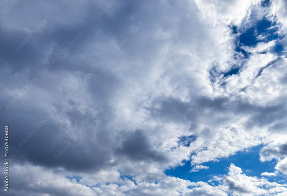 A cloudy sky with dramatic formations and patches of bright blue, capturing a tranquil yet dynamic scene A cloudy sky with dramatic formations and patches of bright blue, capturing a tranquil yet dynamic scene