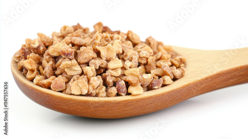 Crumpled granola in wooden spoon, perfect for healthy snacks and breakfast