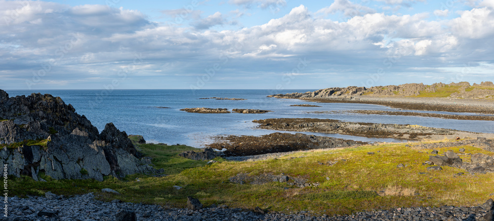 Fototapeta premium Untamed and rugged coast of Barents Sea on a warm summer evening. Hamningber, Varanger Peninsula