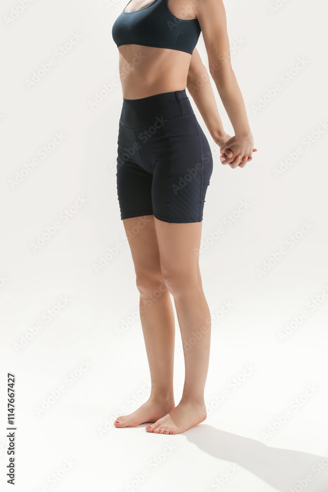 Young woman practicing stretching yoga positions, wellbeing and self care concept Young woman practicing stretching yoga positions, wellbeing and self care concept