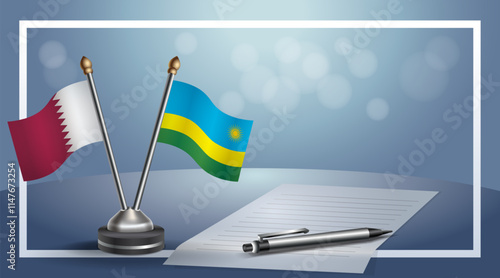 Qatar and Rwanda National flags on small table with bokeh background, cooperative relationship