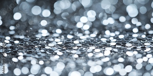 Close up of a shimmering silver sequins pattern, creating a stylish texture ideal for fashion backgrounds. This silver sequins pattern enhances any design with its captivating texture and allure.