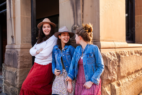 Group of teen girls chatting together in urban setting in country town