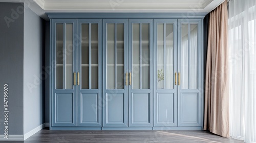 Elegant blue glass-front wardrobe in modern interior.