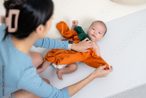 Adorable Baby in Pumpkin Halloween Costume photo