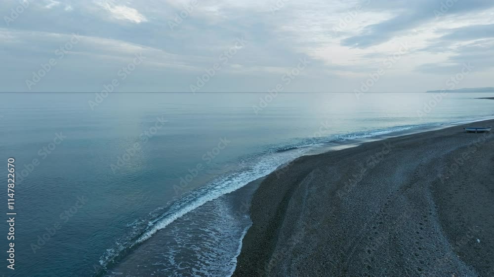 Calm waves of Ocean on the shoreline, aerial Calm waves of Ocean on the shoreline, aerial