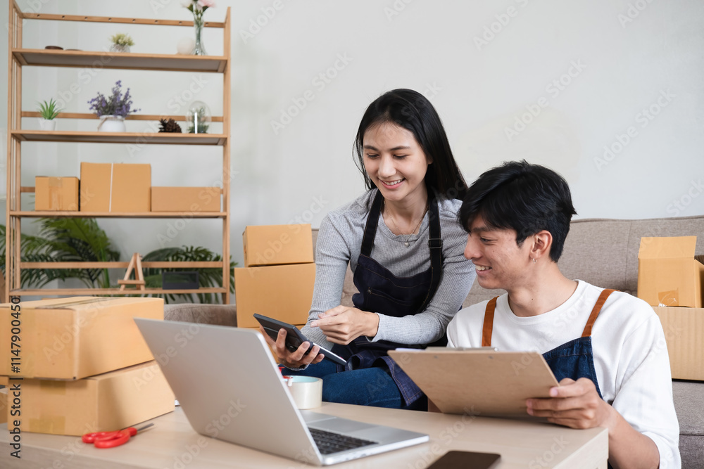 Young Couple Managing Online Business, Taking Orders, and Packing Products in a Modern Home Office Setting Young Couple Managing Online Business, Taking Orders, and Packing Products in a Modern Home Office Setting