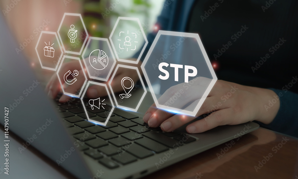 Fototapeta premium Segmentaion, targeting, positioning STP Marketing Model. Working on laptop with STP icon. Identify different customer groups, select groups to prioritize, and create brand’s unique value proposition.