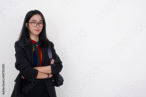 Asian businesswoman standing alone with calm facial expression photo