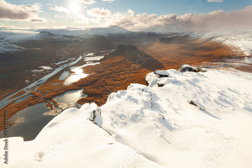 Epischer Ausblick vom Skierffe im Nationalpark Sarek  Lappland in Schweden. Spätherbst und Schnee zum Sonnenuntergang auf dem Gipfel mit Blick ins Delta des Rapaälv. photo