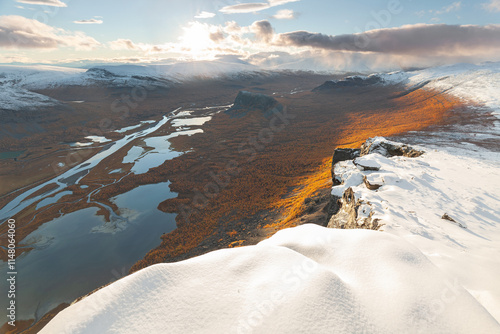 Epischer Ausblick vom Skierffe im Nationalpark Sarek  Lappland in Schweden. Spätherbst und Schnee zum Sonnenuntergang auf dem Gipfel mit Blick ins Delta des Rapaälv. photo