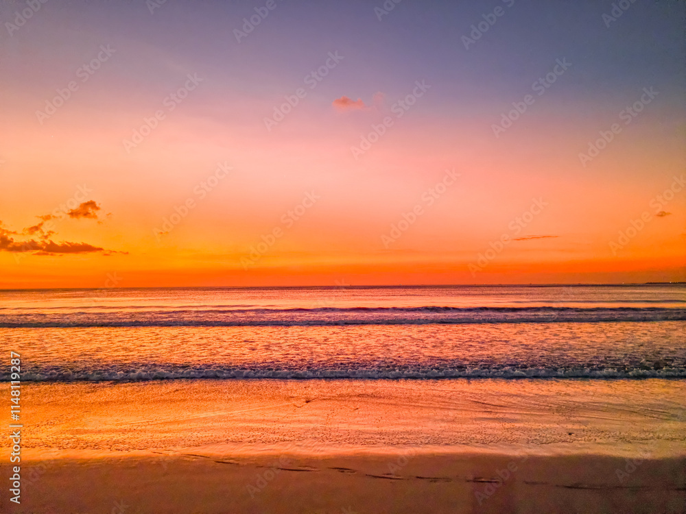 Sunset over the ocean in Jimbaran beach, Bali, Indonesia Sunset over the ocean in Jimbaran beach, Bali, Indonesia