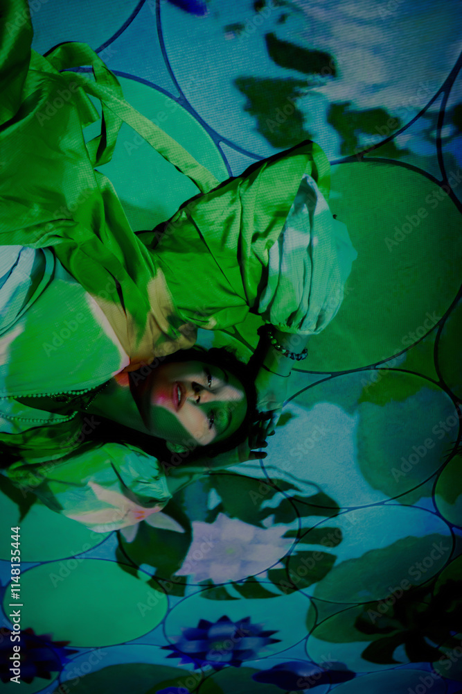 Young female in abstract green light and patterned world Young female in abstract green light and patterned world