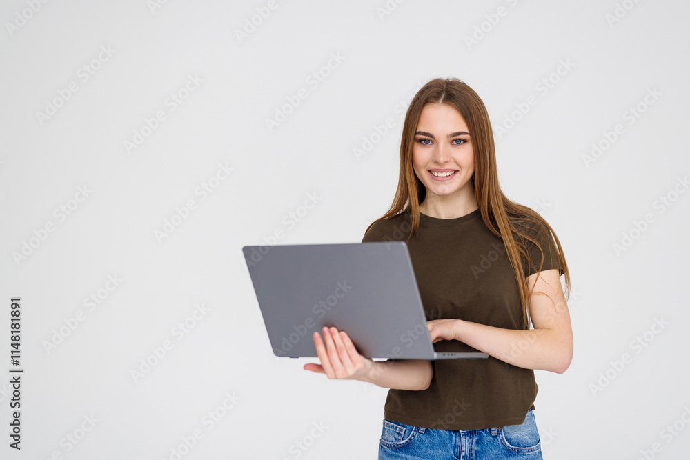 Young smilingwoman using laptop for remote work, e-learning at university college isolated in white background Young smilingwoman using laptop for remote work, e-learning at university college isolated in white background