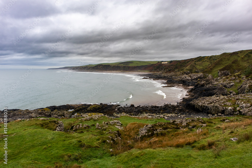Rocky coastline and small bay in overcast weather Rocky coastline and small bay in overcast weather