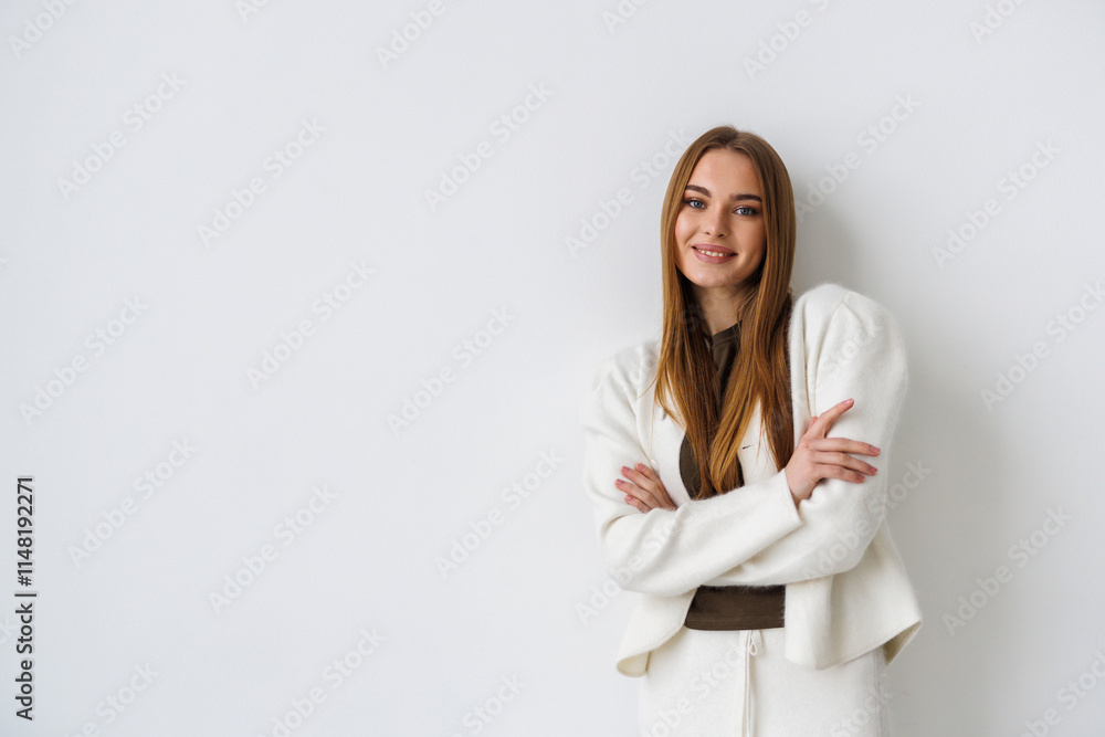 Smiling business woman isolated on white background with crossed arms Smiling business woman isolated on white background with crossed arms