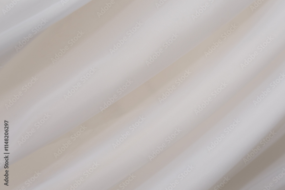 Obraz premium Soft and gentle fabric draping over a minimalist background in a well-lit space