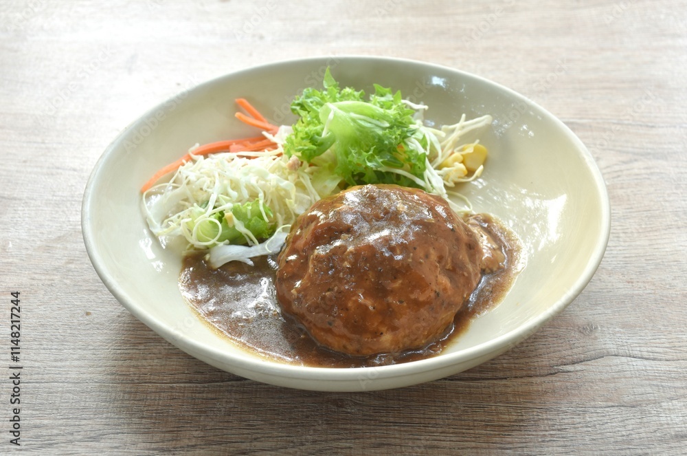 grilled chop pork steak burger dressing gravy sauce with salad on plate grilled chop pork steak burger dressing gravy sauce with salad on plate