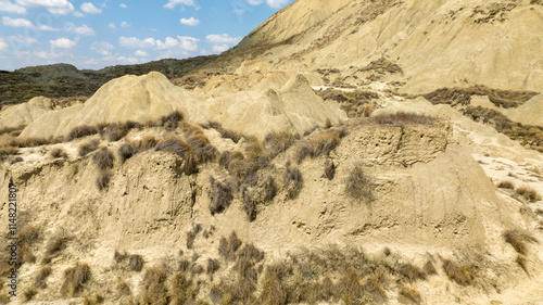 Aerial view of the Calanchi near Pisticci, in the province of Matera, Basilicata, Italy. Badlands are a type of dry terrain where sedimentary rocks and clay-rich soils have been eroded away.